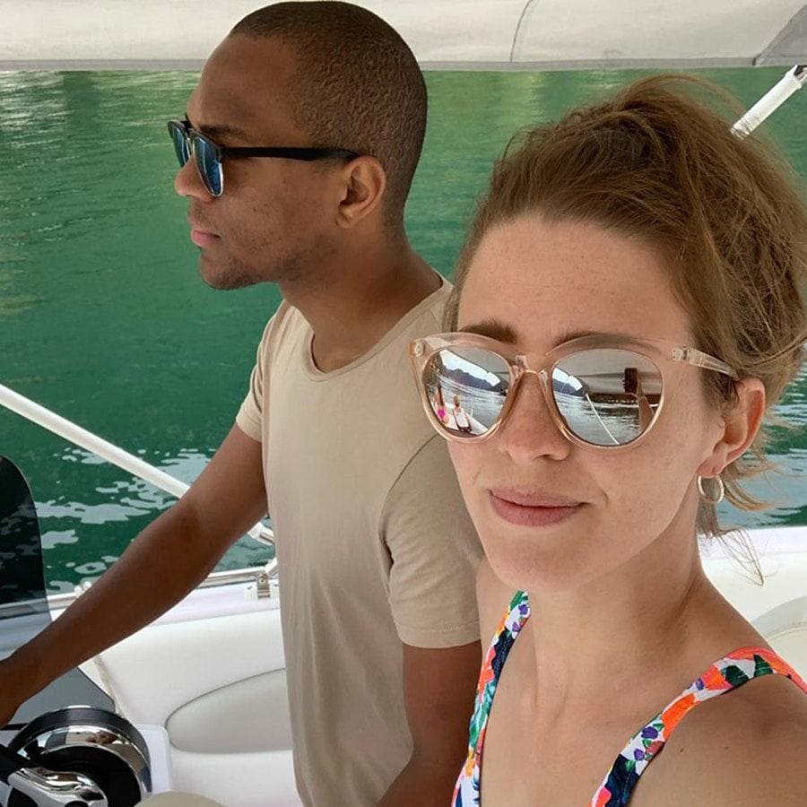 Cally is snapping a selfie of her and Edi driving the boat.