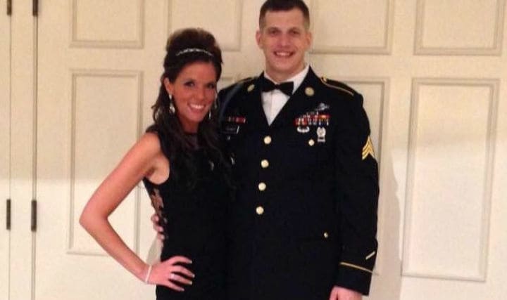 Tyler in his nice dress uniform and Mandi in a black dress.