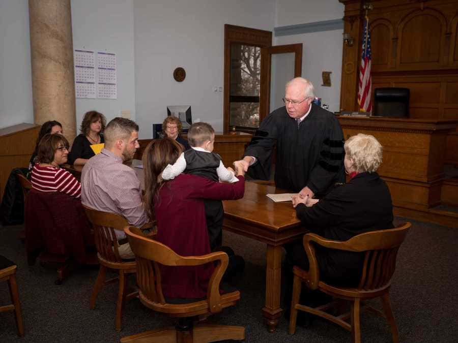 The judge down at the bench with Mandi, Tyler, and the family shaking Mandi’s hand.