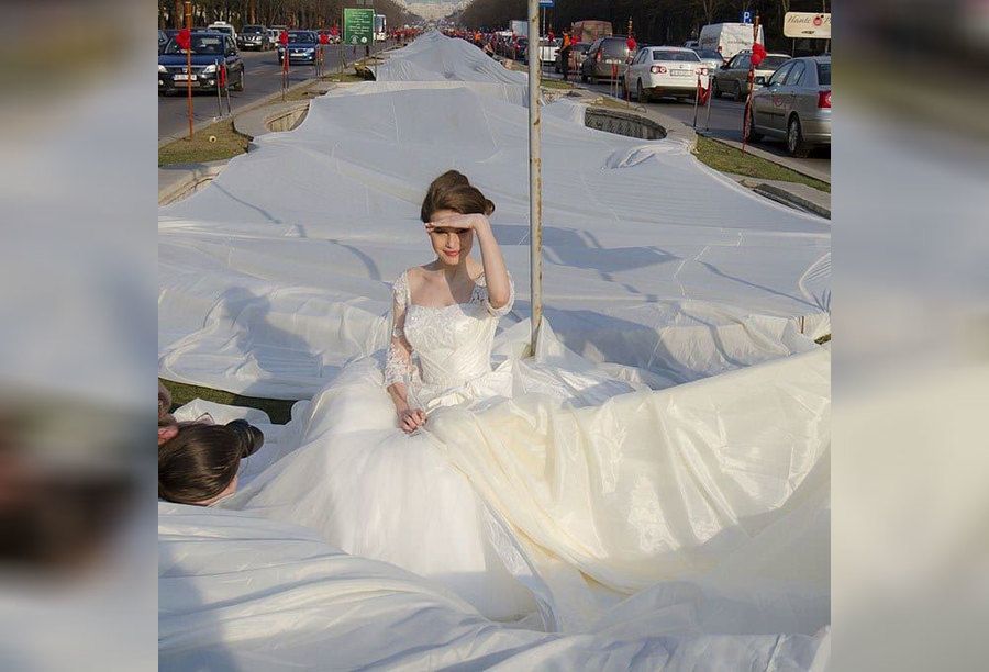 A wedding dress with a ridiculously long tail 