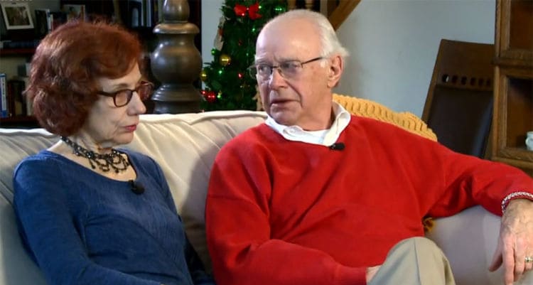 Denis and Karen on the couch during an interview.