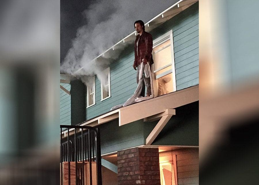 Jack Pearson standing outside of the kids window while the fire is going on in This Is Us.