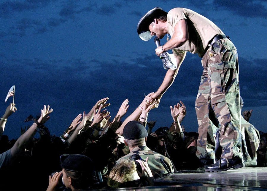 Tim McGraw performing at a concert for military personnel, 2003.