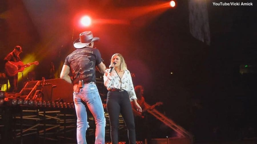 Tim McGraw and daughter Gracie McGraw on stage together.