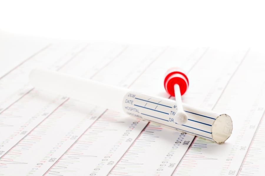 Stock photo of DNA test tube and a cotton swab.