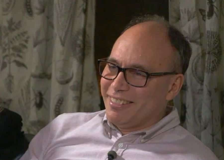 Photography of Aaron Long smiling.