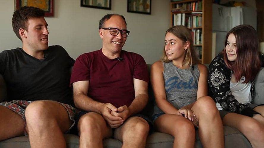 Alice, Maddie, Bruce, and Aaron sitting on a couch in a living room.