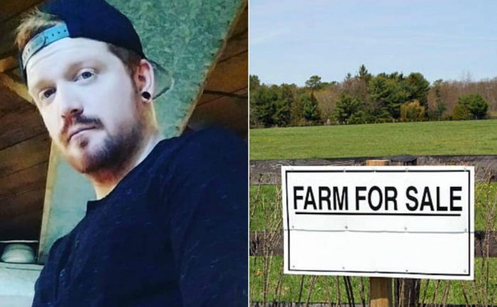 A middle-aged guy with a baseball cap on / A wooden fence with a sign posted outside of it stating Farm for Sale