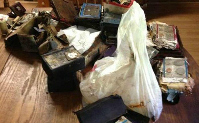 A pile of antique items, including a lot of coins