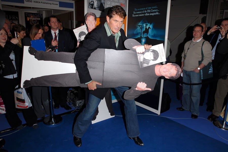 David Hasselhoff is walking around with his own cardboard cutout holding an autographed photo of himself.