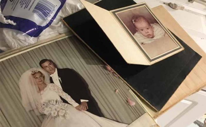 Family photos in a mess on the kitchen floor