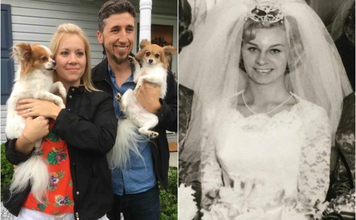 Megan Kapsidis holding up the wedding album