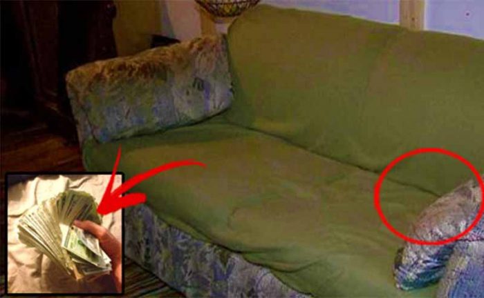 ugly couch taken apart with marks of where money was found