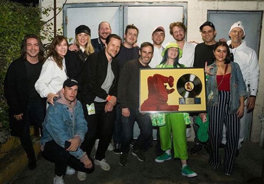 Billie Eilish with her brother and her crew when Ocean Eyes went Gold. 