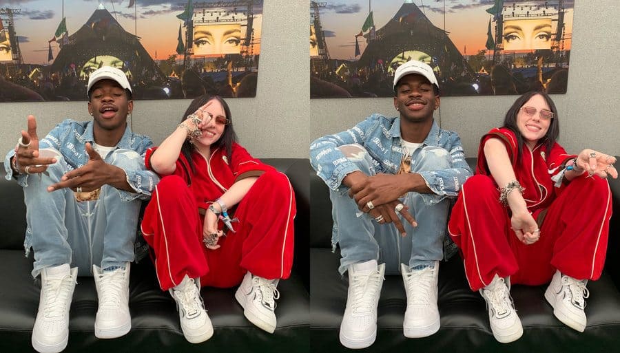 Billie Eilish and Lil Nas X are sitting on the couch posing together. 