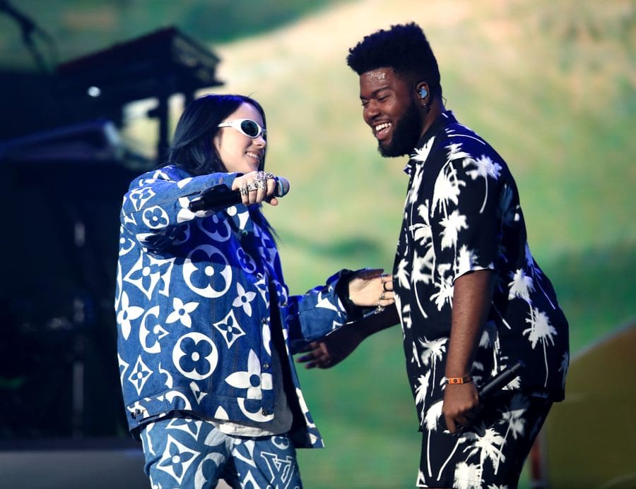 Billie Eilish and Khalid about to hug and say hi on stage at Coachella in 2019. 