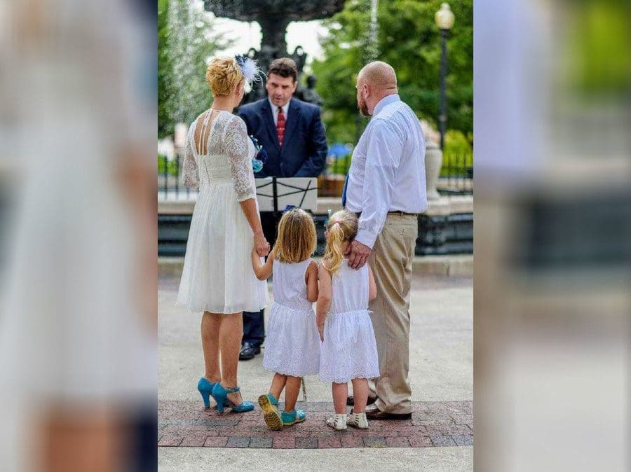 Rebecca and Steven on Their Wedding Day with their daughters by their side. 