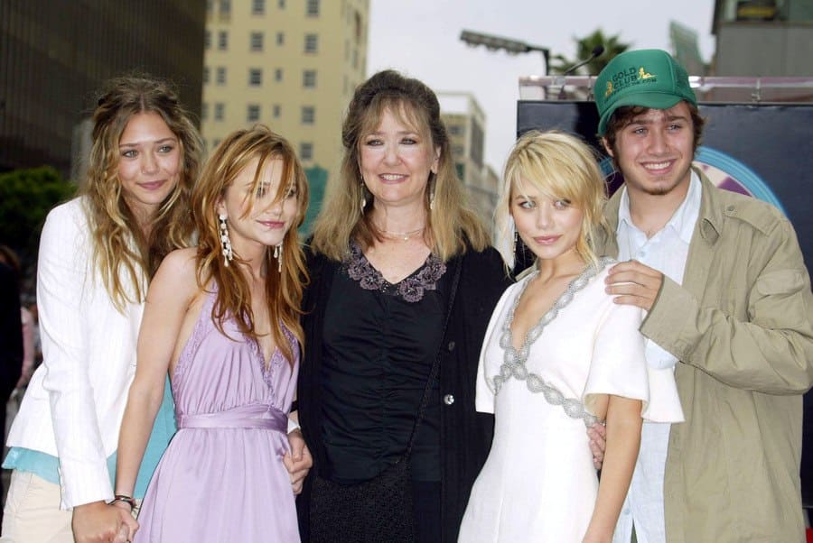 Mary-Kate and Ashley Olsen with their sister Lizzy, mother Jarnett, and bro...