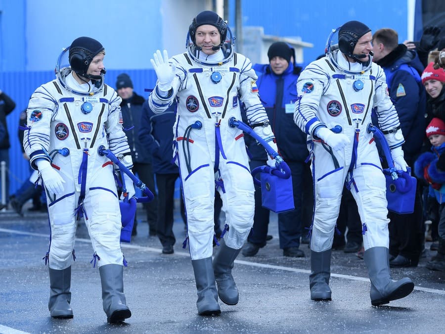 NASA astronaut Anne McClain, Oleg Kononenko, David Saint-Jacques