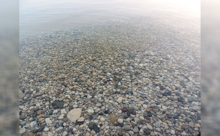 Stones and pebbles under the shallow waters of a lake