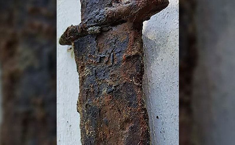 A close-up of the rusty sword