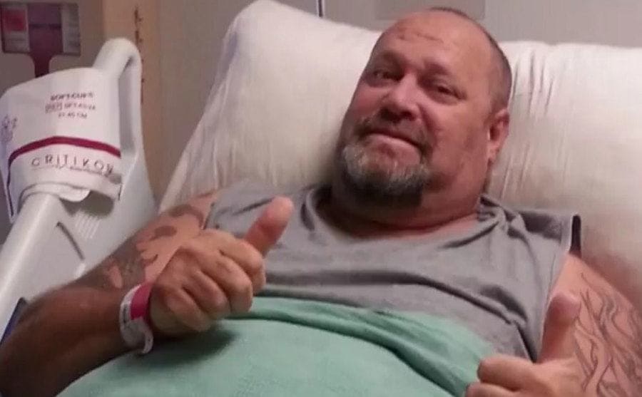 Loren is lying in a hospital bed, recovering
