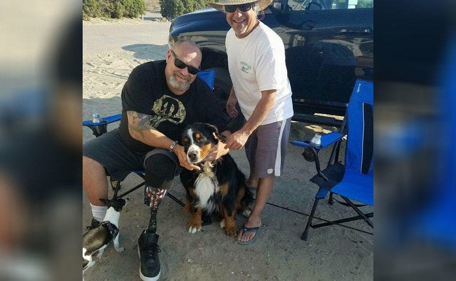 Loren with two dogs and his friend