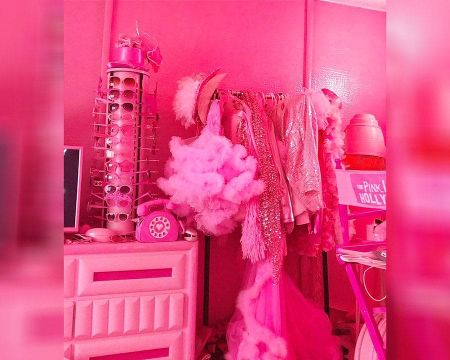 Kitten Kay Sera's pink wardrobe is sitting next to her pink dresser drawers with her sunglasses on them. 