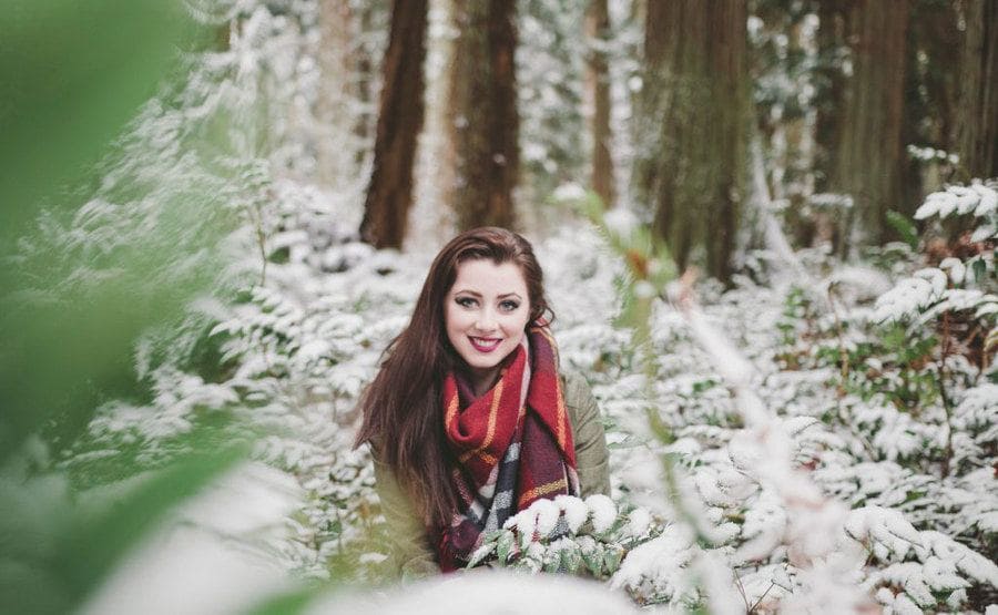 Laura photographed in the snow-covered trees 