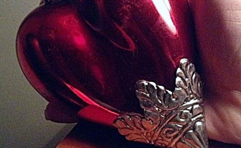 A red ornament with silver