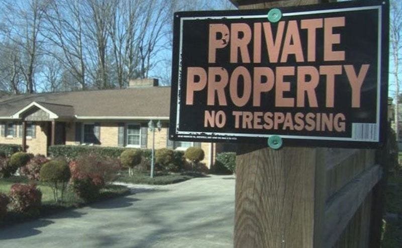 A house with a ‘Private Property no trespassing’ sign 