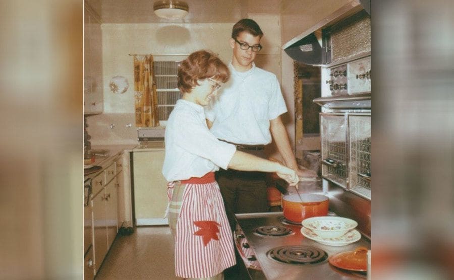 Janice Rude and Prentiss Wilson in the kitchen while Janice cooks 