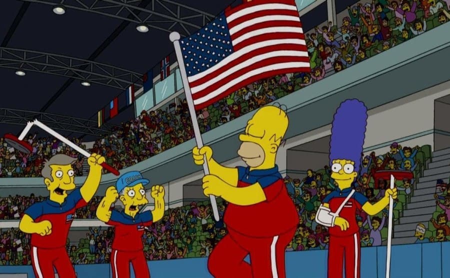 Homer waving an American flag around celebrating their gold win in curling on ‘The Simpsons’