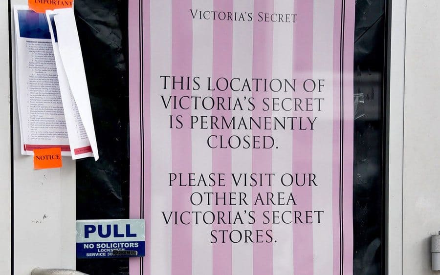 A sign on Victoria’s Secret store door that announced that the location is permanently closed 