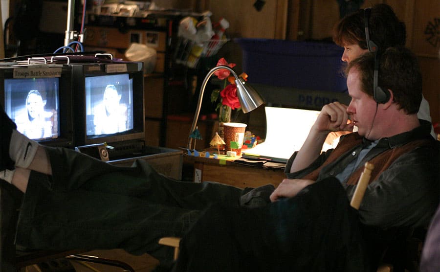 Joss Whedon behind the scenes watching Sarah Michelle Gellar on smalls screens