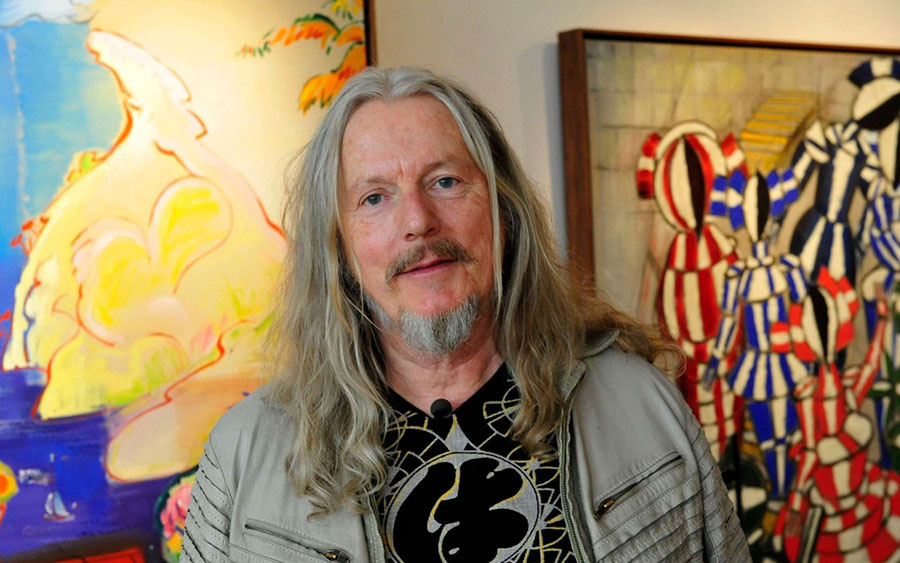 Wolfgang Beltracchi with his paintings in the background 