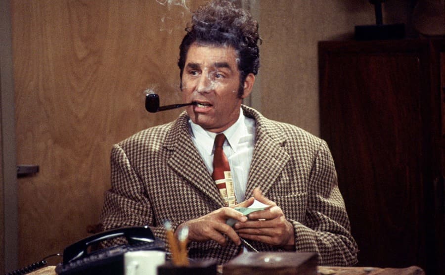Michael Richards as Kramer in “Seinfeld” while he smokes a tobacco pipe 