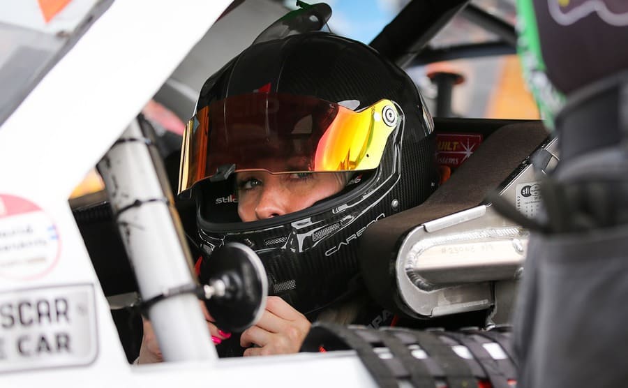 Angela Ruch behind the wheel of a racecar 
