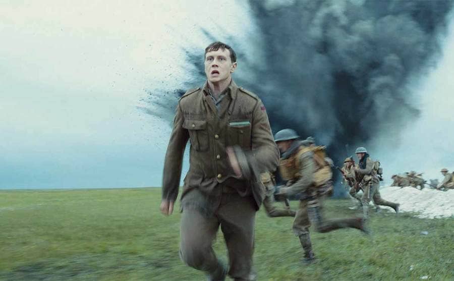 George Mackey running from an explosive in the film 1917
