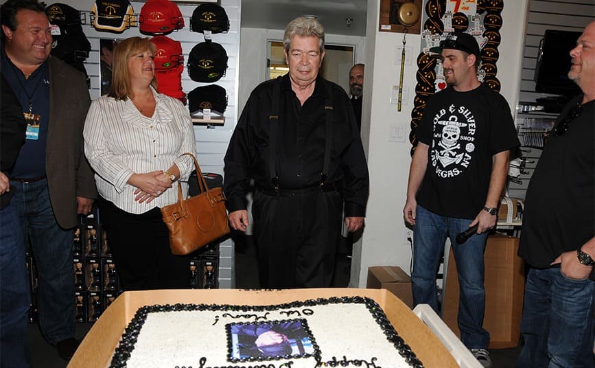 Richard Harrison on his 71st birthday with a large cake in the store 