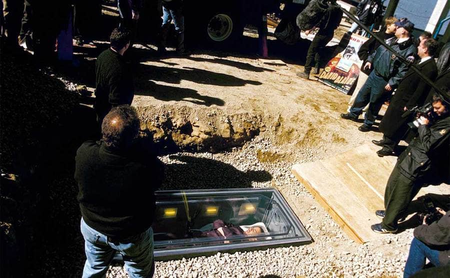David Blaine buried alive while people film and watch him 