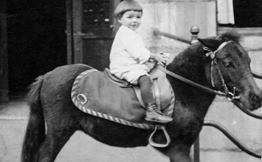 Phil as a baby riding a pony 