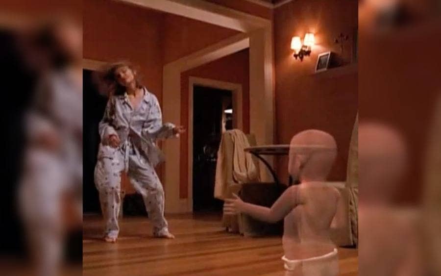 Calista Flockhart dancing with the animated baby in Ally McBeal 