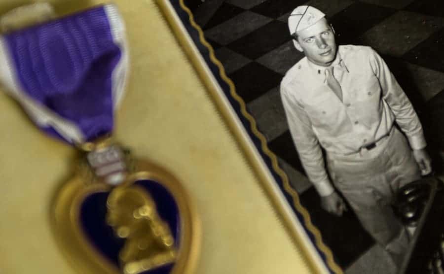 A photograph of Royce Gibson in uniform next to his purple heart 