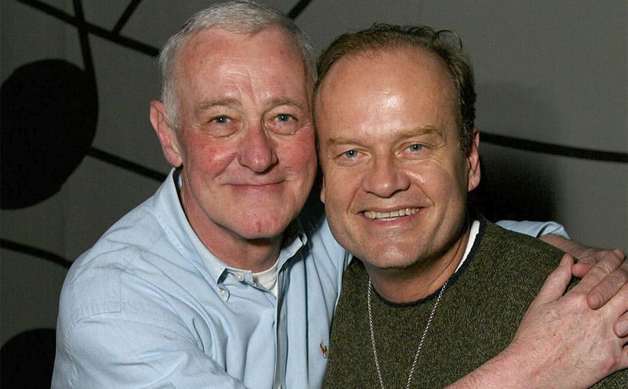John Mahoney and Kelsey Grammer posing together at an event in 2002