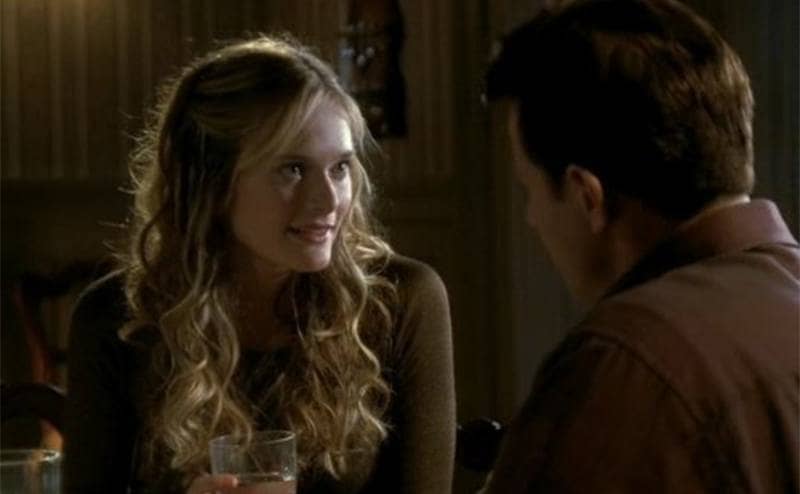 Rachel Blanchard sitting at a table across from a guy on 7th Heaven 