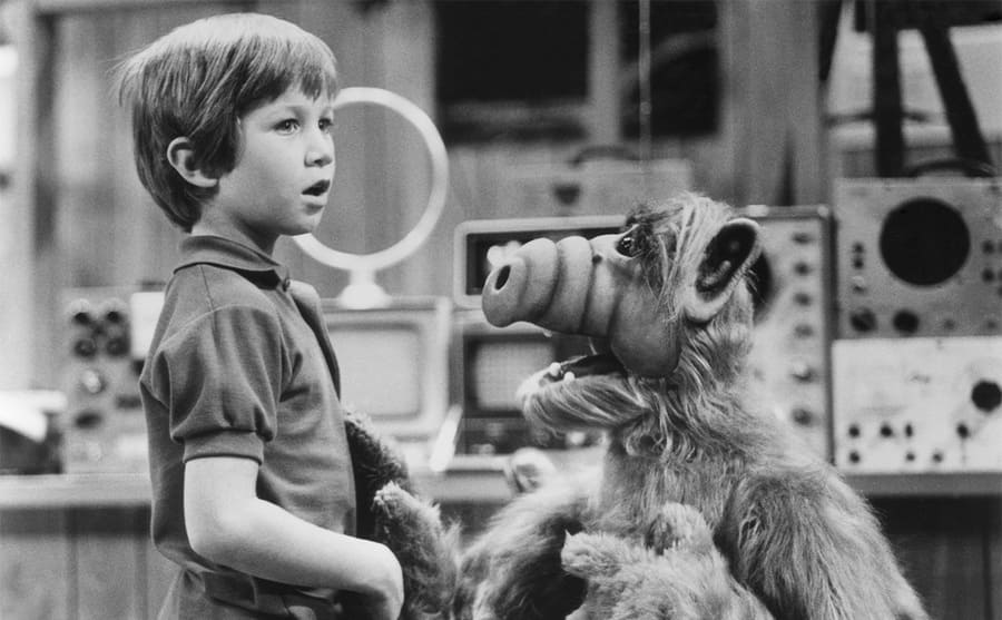 Benji Gregory and ALF in a scene from ALF