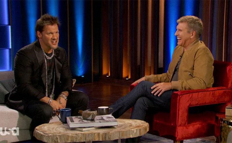 Todd Chrisley interviewing Chris Jericho who is sitting in front of him