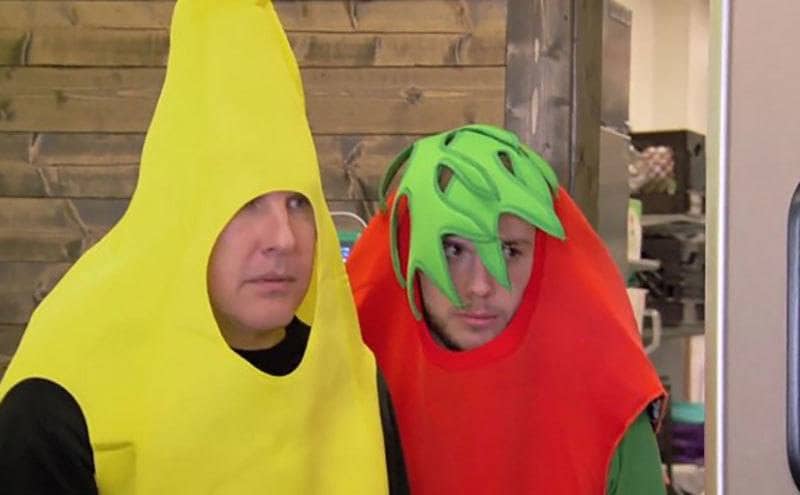 Todd Chrisley and his son Chase dressing up in banana and strawberry costumes