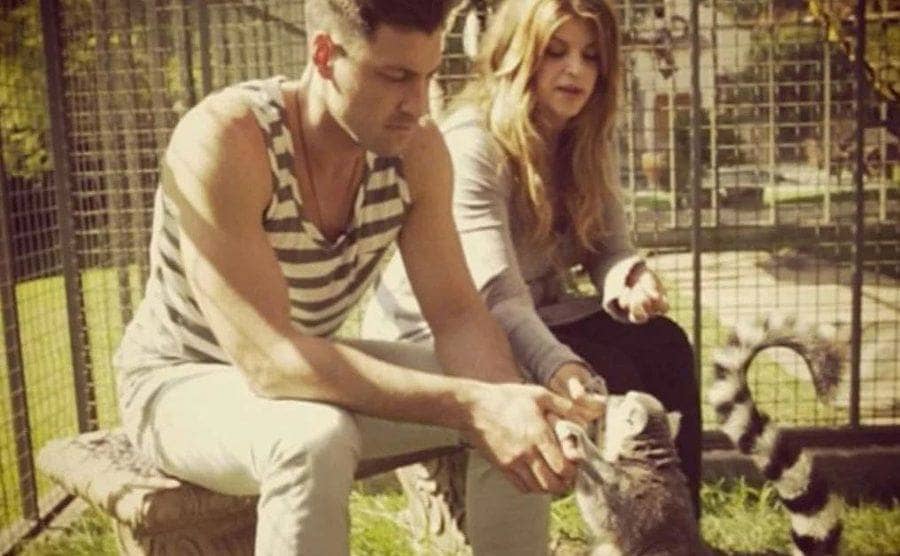 Max Chmerkovskiy and Kirstie Alley playing with lemurs